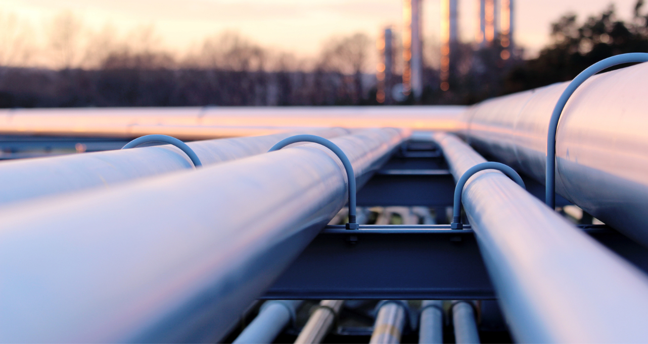 Industrial pipelines in energy infrastructure facility.