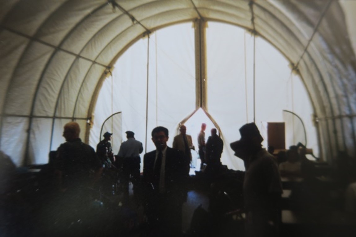 Travellers waiting inside a temporary tent at Zagreb Airport.