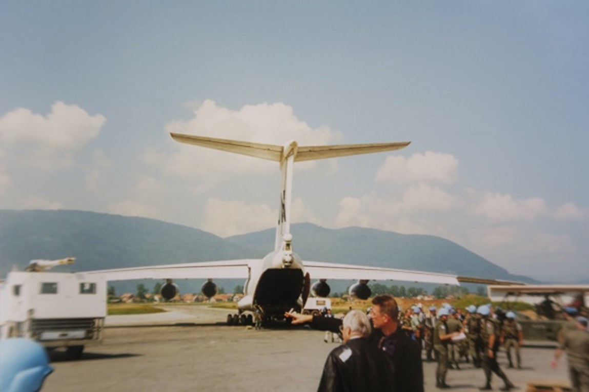 Aircraft unloading passengers on a remote airfield.