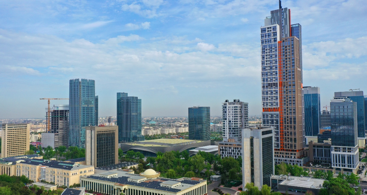 Aerial view of Tashkent city showcasing modern skyscrapers against a clear blue sky