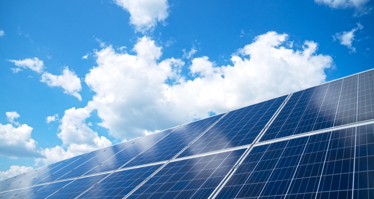 Blue solar panels with blue sky