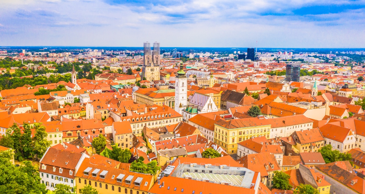 Stunning drone aerial image of old town of Zagreb, capital of Croatia, featuring upper town landmarks, colorful traditional architecture, and the beautiful skyline in the background