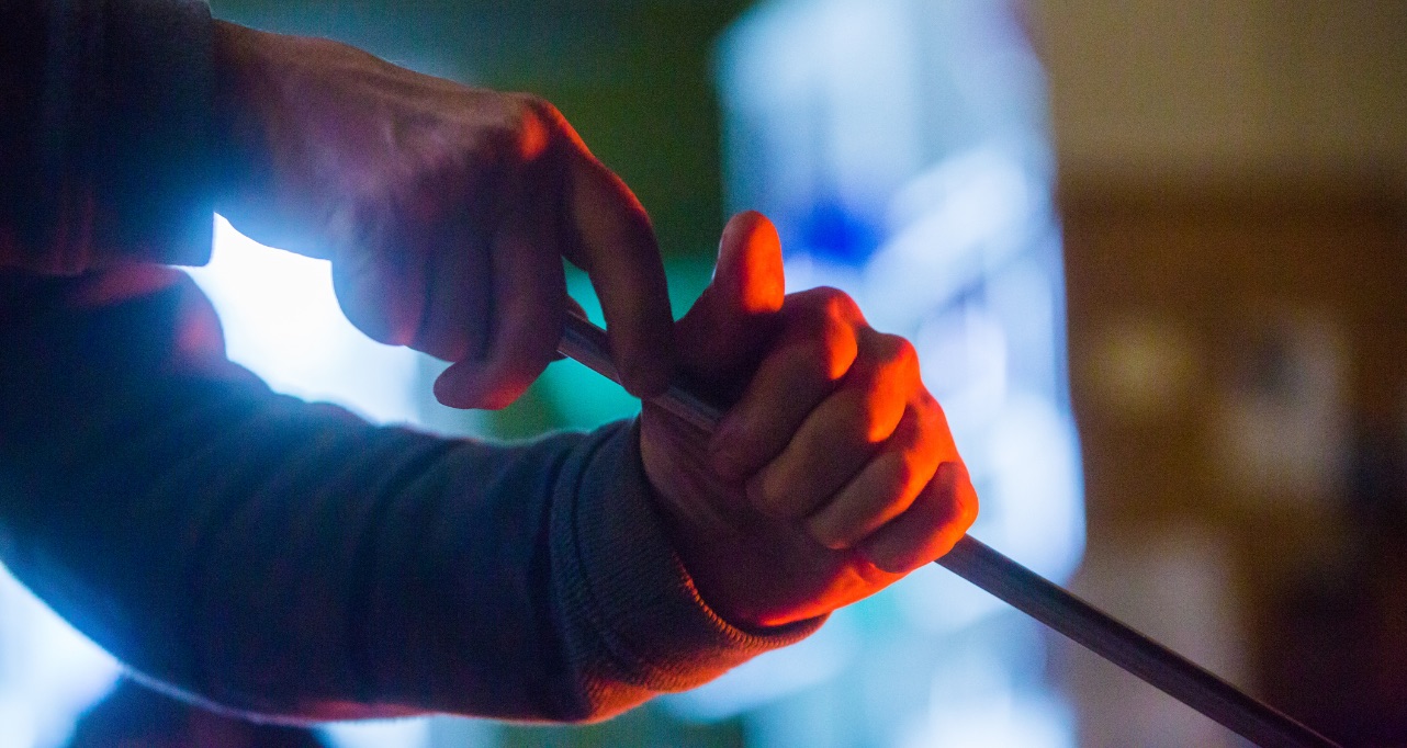 Glassblowers making a vase in the glassworks studio