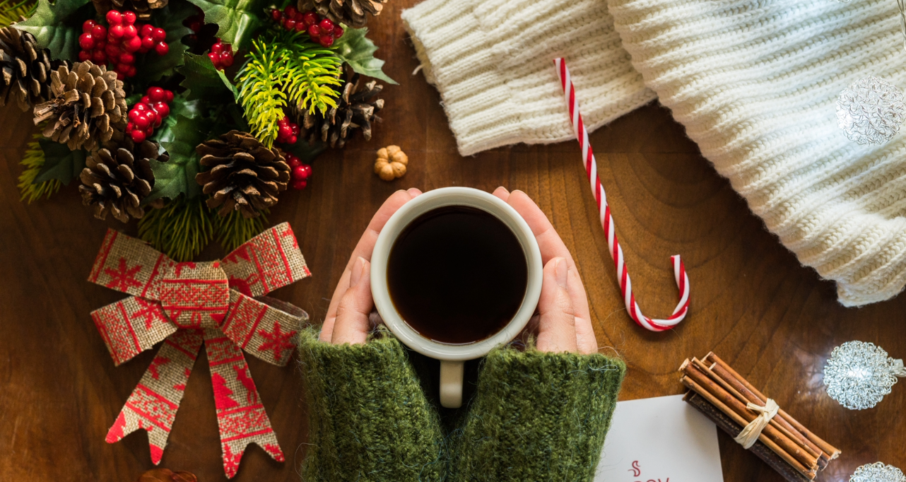 Hands holding coffee cup