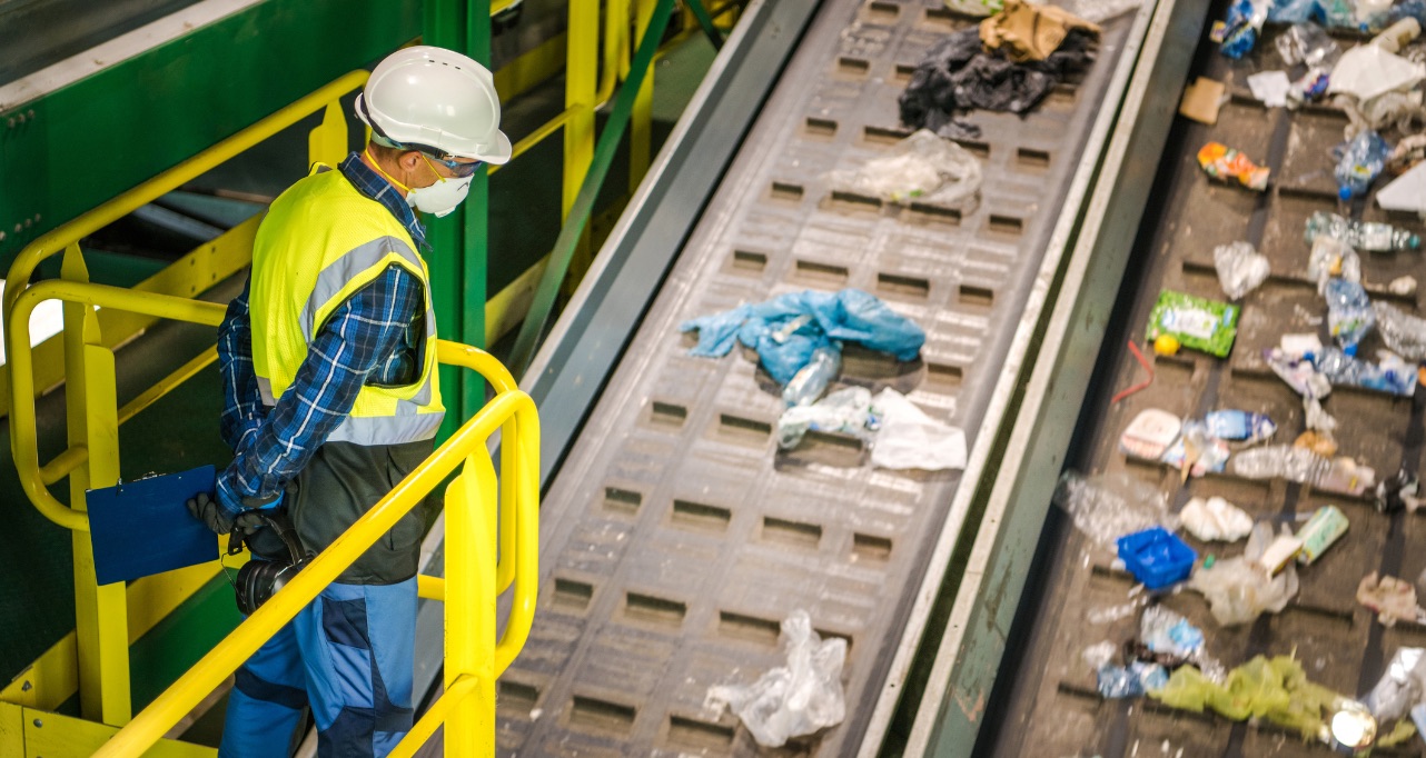 Waste Sorting Facility Management Control. Trash Conveyors Operator Performing Daily Check.
