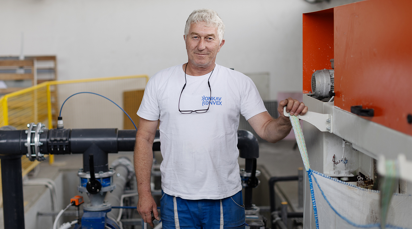Man standing in a glass manufacturing factory