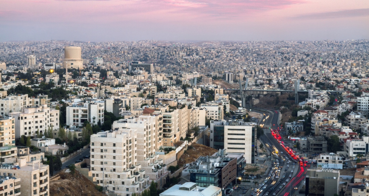 Aerial shot of Abdoun bridge and Jabal Amman after sunset