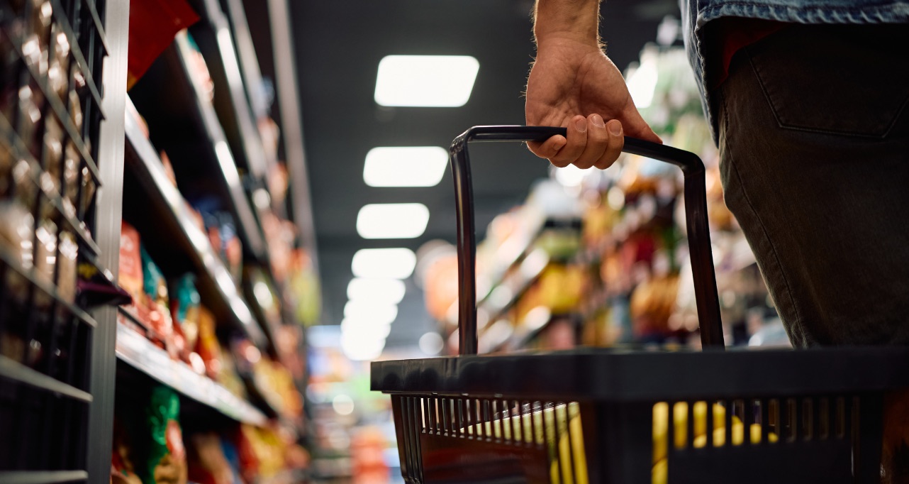 Close up of man buying groceries in supermarket