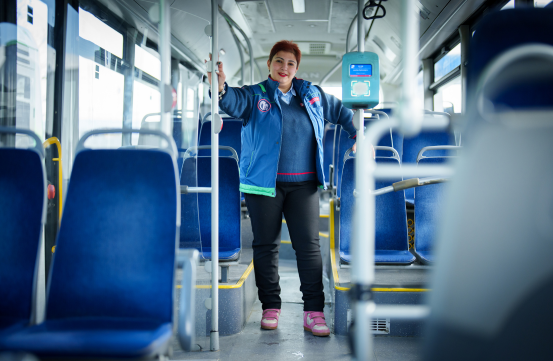 Bus driver on a city bus in Tbilisi, Georgia, highlighting EBRD support for sustainable urban transport.