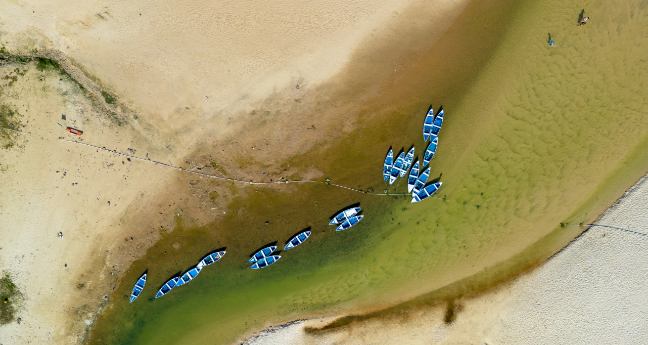 Small boats stranded in the river during drought