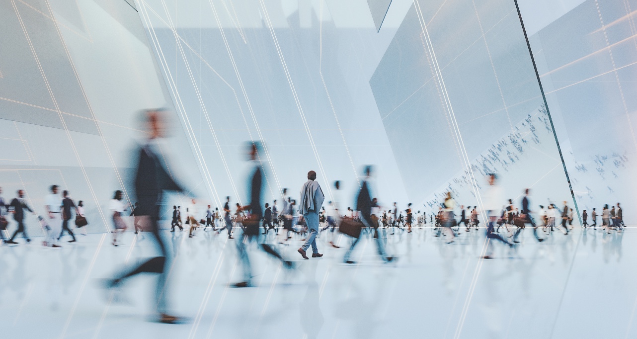 Business professionals walking through an office building Business professionals walking through an office building