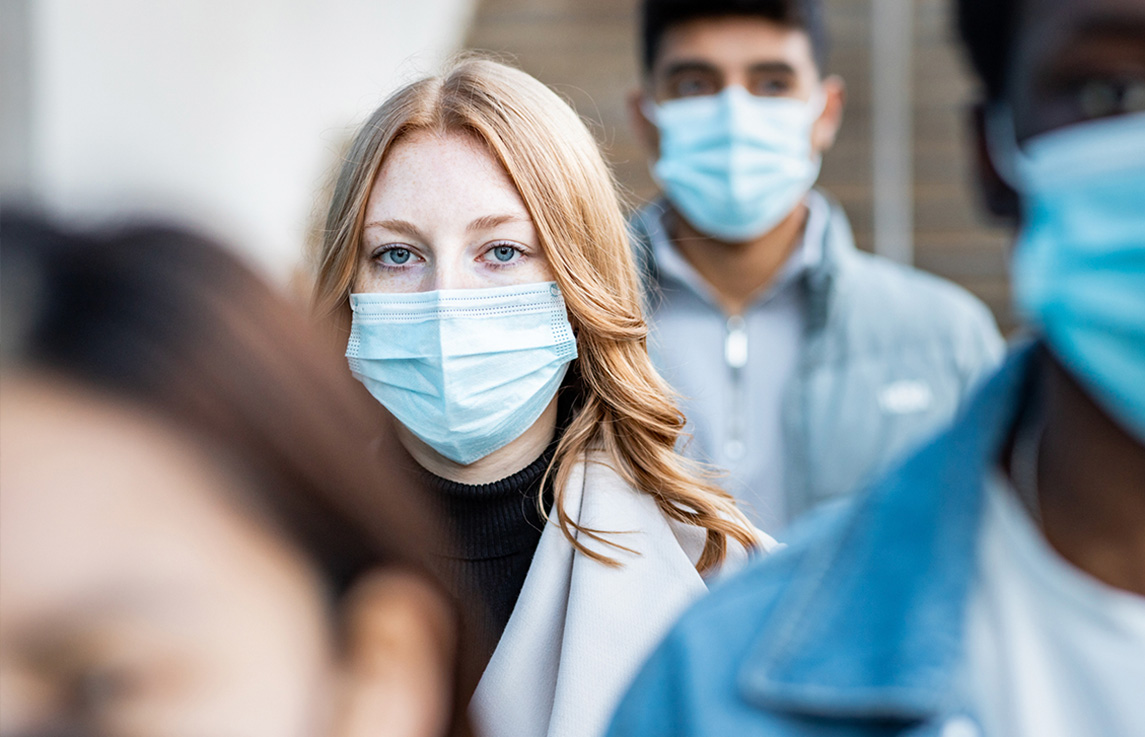 people in street wearing protective face masks